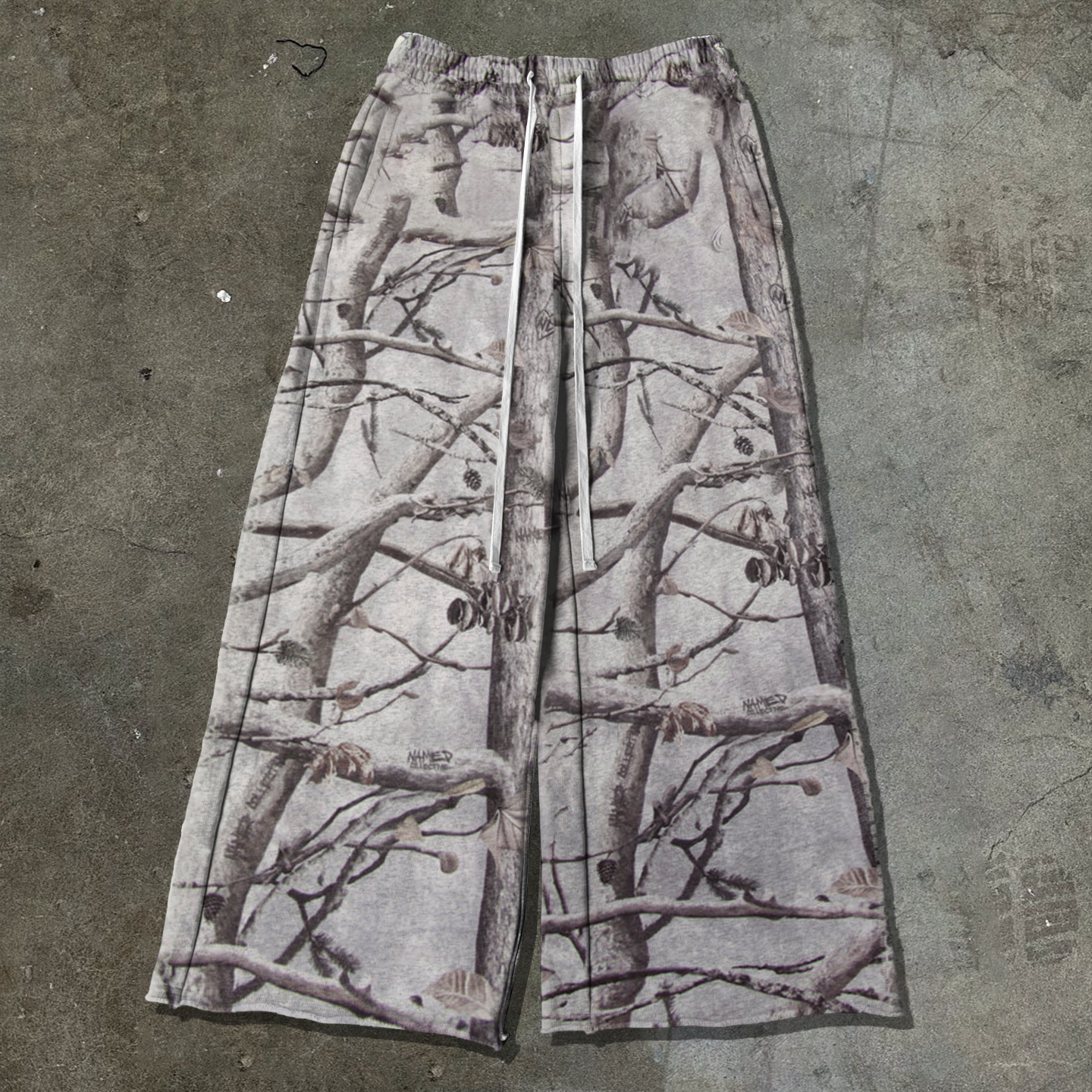 Tree camouflage print trousers